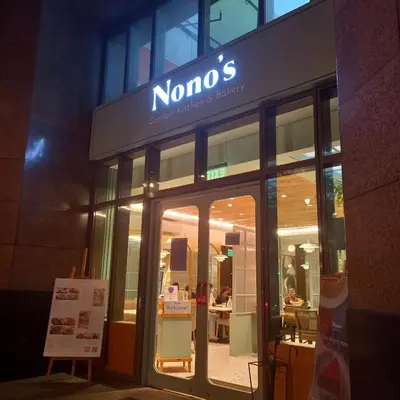 a nomo sign on the front of a building at One bedroom Apartment with Netflix at Greenbelt Makati in Manila