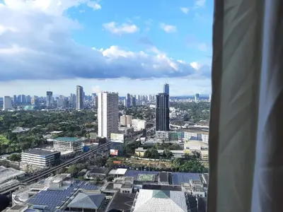 a view of a city from the top of a building at Comfy Bunkbed with Pool in Manila
