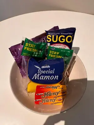 a pile of snacks on a plate on a table at Uptown BGC Luxury 1br Suite with Fast Wifi in Manila