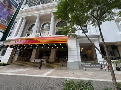a person walking in front of a building at Uptown BGC Luxury 1br Suite with Fast Wifi in Manila
