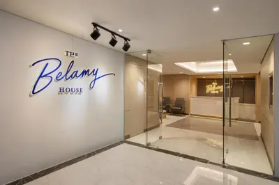 a lobby with a beaumont house sign on the wall at The Belamy House Managed by HII in Manila