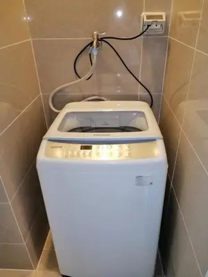 a white toilet in a bathroom with a wall at Uptown Parksuites Apartments Tower 1 BGC by PH Staycation in Manila