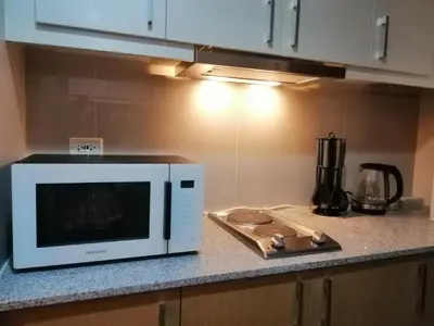 a microwave oven sitting on a counter in a kitchen at Uptown Parksuites Apartments Tower 1 BGC by PH Staycation in Manila