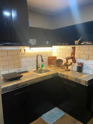 a kitchen with a sink and a counter top at IV’s Condo w/ Netflix and Wi-Fi in Cainta