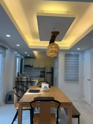 a kitchen with a table and chairs and a ceiling at Family Friendly Cozy Village Stay Sta Rosa Belair in Santa Rosa