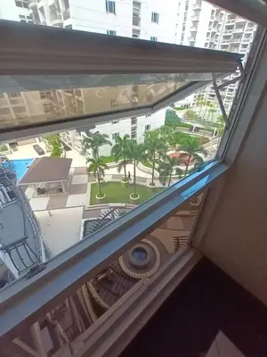 a view from a window of a building with palm trees at Sobere Unit in Manila