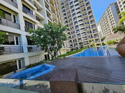 a swimming pool in the middle of a building at Sobere Unit in Manila