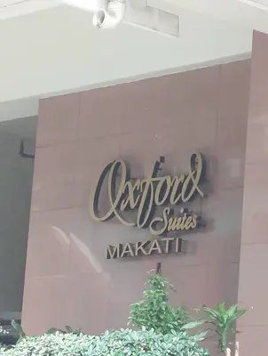 a sign for a restaurant on the side of a building at SAB R.CONDOTEL and room rental in Manila