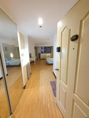 an empty room with a hallway with a door at SAB R. CONDOTE'L SUITES in Manila