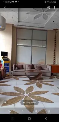 a living room with a couch and a table at ETON BAYPARK MANILA by TRIPLE VIEW CONDOTEL in Manila