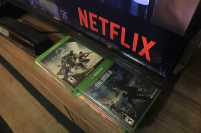 a shelf filled with video games on a tv at A2J Luxury 2BR Suite Near High Street BGC Taguig in Manila