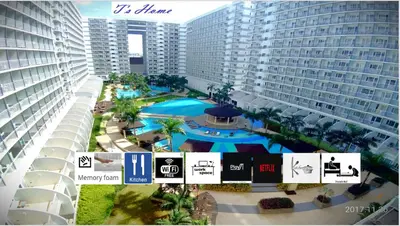 an overhead view of a swimming pool in front of buildings at Best staycation at Shell residences in MOA complex in Manila