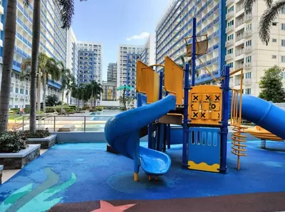 a playground in a city with a slide at Sea Residences Staycation Tanya's Condo Pasay in Manila
