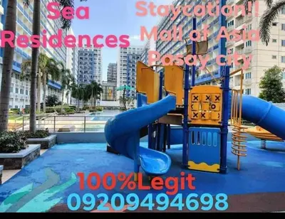 a playground in a city with a slide at Sea Residences Staycation by TVANS CONDOTEL Pasay City in Manila