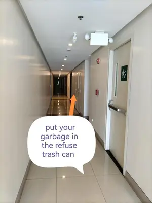 a hallway in a hotel with an orange arrow on the ceiling at One Uptown Opposite of grandhyatt hotel manila Taguig city in Manila