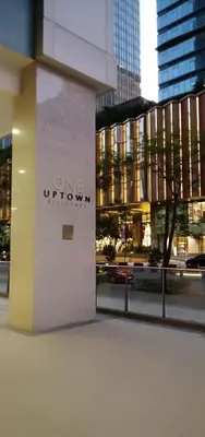 a building with the one uptown sign on it at One Uptown Opposite of grandhyatt hotel manila Taguig city in Manila