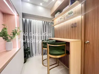 a room with a desk and a chair in a room at A2 Executive Pad & Staycation in Manila