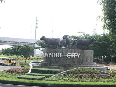 a statue of cows standing on top of a monument at 101 Newport condo in Pasay near airport in Manila