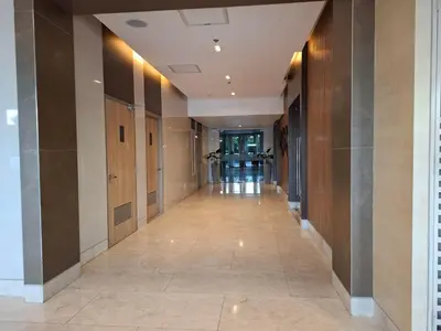 a hallway in a building with wooden walls at Shore Residences MOA by darpm in Manila