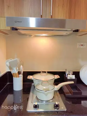 a pot sitting on a stove in a kitchen at Happirest at Shore 3 Residences with Balcony, Mall of Asia in Manila