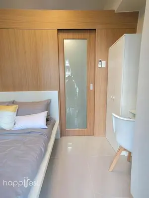 a bedroom with a bed and a sink and a tub at Happirest at Shore 3 Residences with Balcony, Mall of Asia in Manila