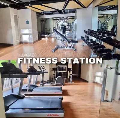 a gym with rows of treadmills and a fitness station at Luxury 1BR Unit with Pool at Venice Luxury Residences, Tower Domenico, McKinley Hill, Taguig City in Manila