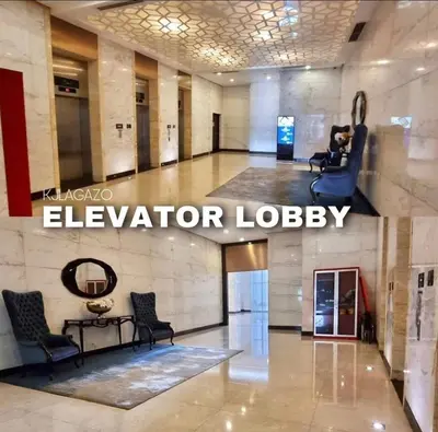 a large lobby with chairs and a elevator lobby at Luxury 1BR Unit with Pool at Venice Luxury Residences, Tower Domenico, McKinley Hill, Taguig City in Manila