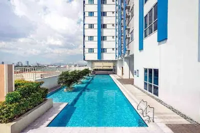 a swimming pool on the side of a building at Sweden's Tiny Home, Studio Unit Condo in Manila