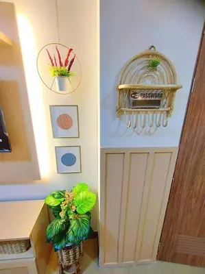 a room with a counter and a plant in a vase at Spring Residences Scandinavian 2 bedrooms with balcony Near NAIA in Manila