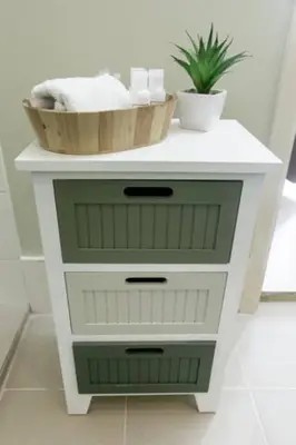 a white cabinet with a sink and a bowl on it at BGC Private Apartments in Manila