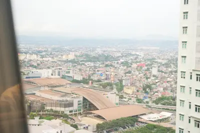 a view of a city from a building at BGC Private Apartments in Manila