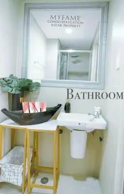 a bathroom with a sink and a mirror at 2BR SMDC Premium Unit: FAME Residences 31st FLOOR in Manila