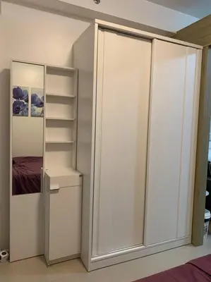 a bedroom with a white closet and a bed at Katei elegantly designed 1-bedroom facing amenity in Manila