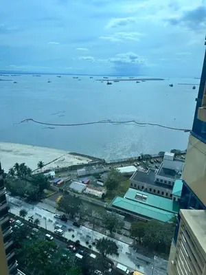 a view of the water from a building at Grand Riviera Suits in Manila