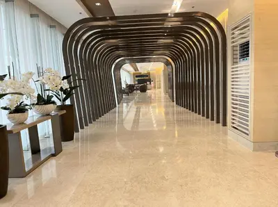 a hallway in a building with a long hallway with flowers at Shore 3 Residences, Tower 1 Mall of Asia Complex, Pasay City, Metro Mania in Manila