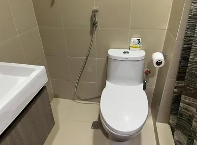 a bathroom with a white toilet and a sink at Shore 3 Residences, Tower 1 Mall of Asia Complex, Pasay City, Metro Mania in Manila