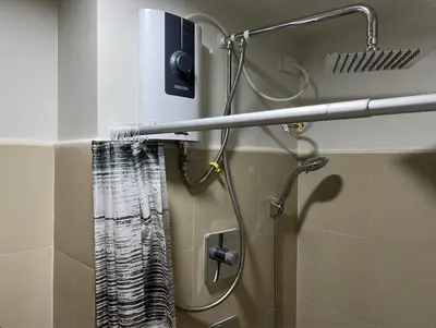 a shower in a bathroom with a shower curtain at Shore 3 Residences, Tower 1 Mall of Asia Complex, Pasay City, Metro Mania in Manila