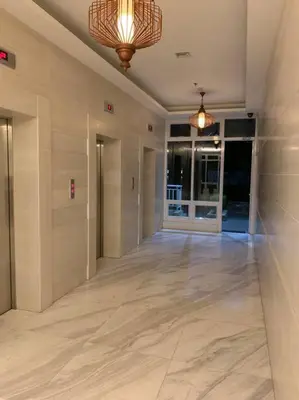 an empty hallway of a building with a hallwayngthngthngthngthngthngthngth at Cozy Place Anuva Residences in Manila