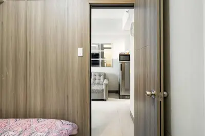 a door leading into a room with a bedroom at Luxury Sunset Views and Prime Location near CCP MOA with WIFI Parking in Manila