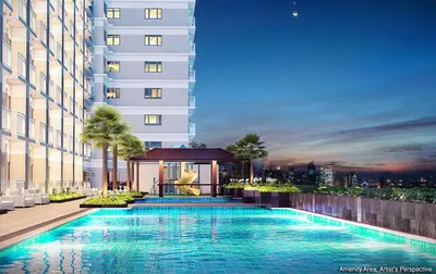 a swimming pool in front of a building at Luxury Sunset Views and Prime Location near CCP MOA with WIFI Parking in Manila