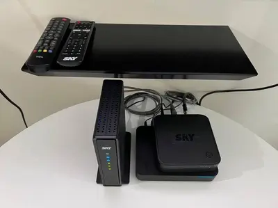 a desk with two remotes and a sitteway with at JAZZ Residences - 1 Bedroom with Balcony - Cable, Wifi & Netflix in Manila