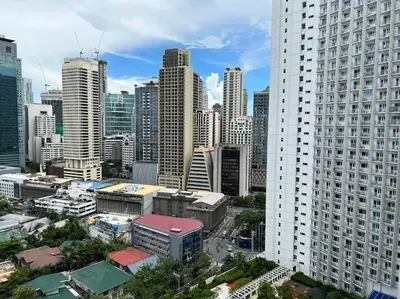 a view of a large city with tall buildings at JAZZ Residences - 1 Bedroom with Balcony - Cable, Wifi & Netflix in Manila