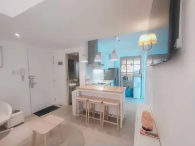 a kitchen with a table and chairs in a room at Azure SKYVIEW PENTHOUSE minimalist unit in Manila