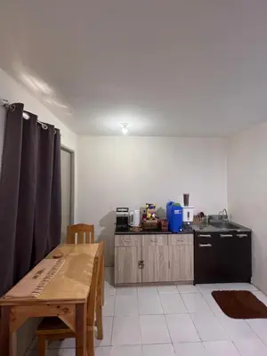 a kitchen with a wooden table and a kitchen with a sink at Dream Condo in Santa Rosa in Santa Rosa