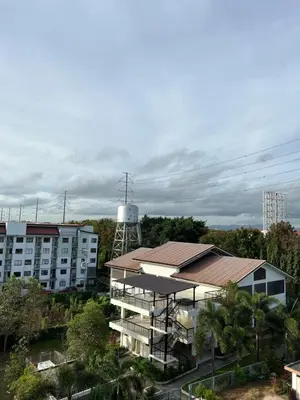 a building with a water tower in the background at Dream Condo in Santa Rosa in Santa Rosa