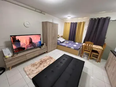 a living room with a tv and a bedroom with a bed at Dream Condo in Santa Rosa in Santa Rosa