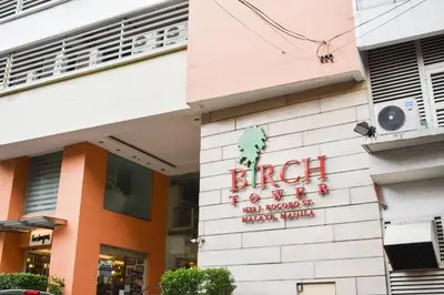 a building with a sign on the side of it at Birchtower by Jeizel Manila City in Manila