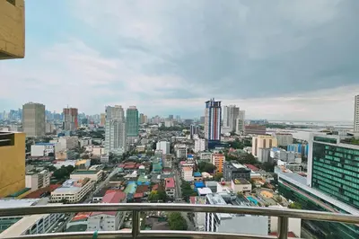 a view of a city from the top of a building at Birchtower by Jeizel Manila City in Manila