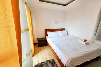 a small bedroom with a bed and a window at Birchtower by Jeizel Manila City in Manila