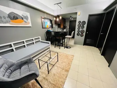 a living room with a couch and a table at C-UY Realtae in Manila
